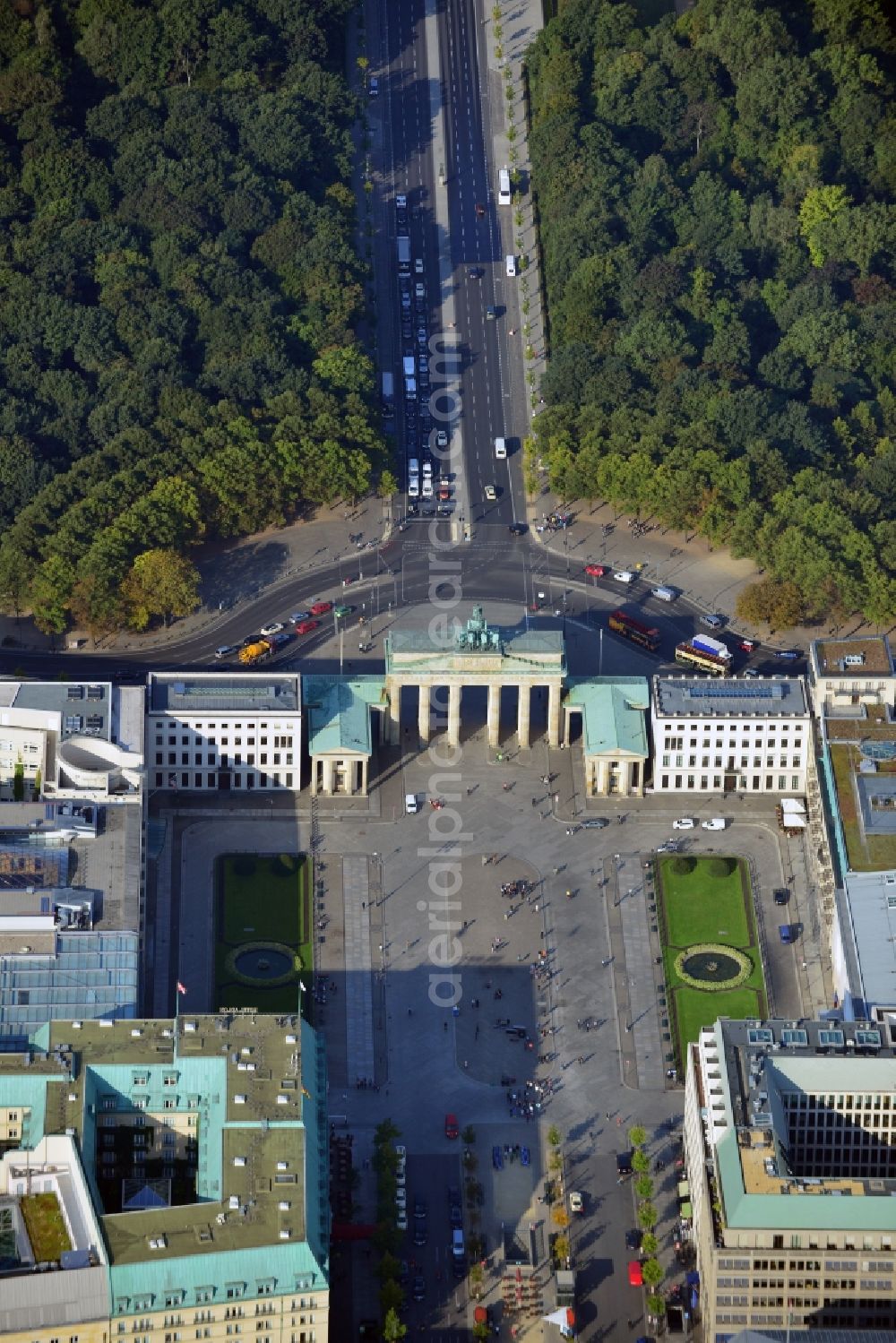 Berlin from the bird's eye view: View of the Brandenburg Gate in Berlin at the Pariser Platz in Berlin. To the left of the Brandenburg Gate is the Commerzbank, the U.S. Embrassy, the DZ Bank, the Academy of Art Berlin and the Hotel Adlon. To the right of the Brandenburg Gate is the Haus Liebermann, the Palais am Pariser Platz, the Eugen-Gutmann-Haus used by Dresdner Bank, the French Embrassy and the Kennedy Museum. Behind the Brandenburg Gate, you can see a part of the urban public park Tiergarten