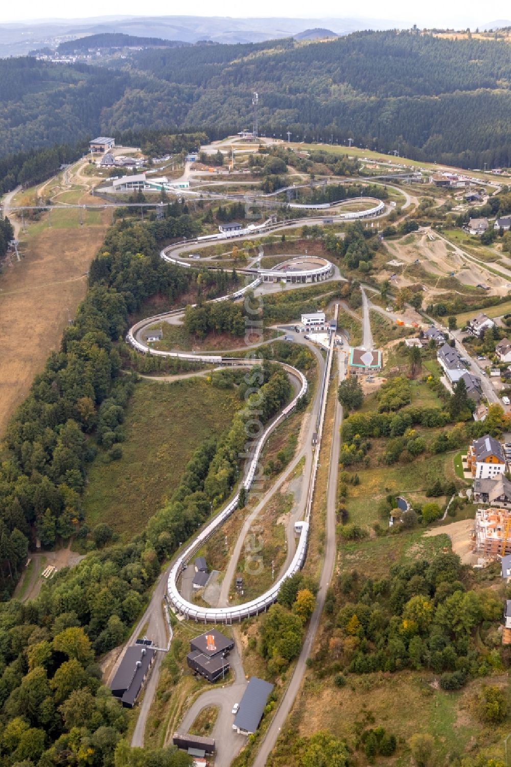 Aerial photograph Winterberg - Serpentine curve of the racetrack route of Bobbahn Winterberg Hochsauerland in Winterberg in the state North Rhine-Westphalia