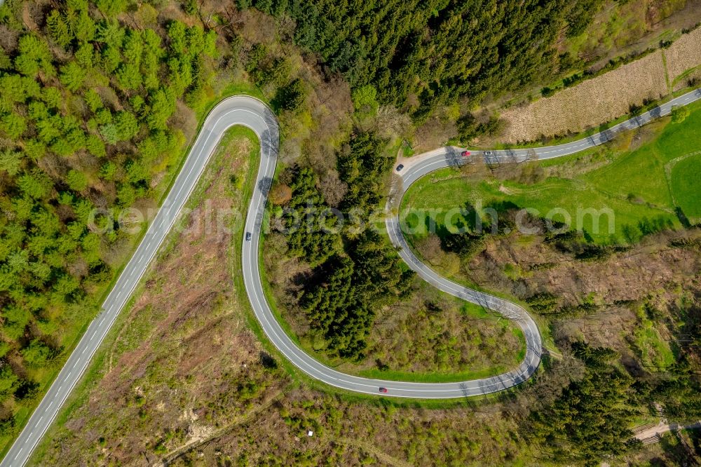 Aerial photograph Brilon - Serpentine-shaped curve of a road guide in Brilon in the state North Rhine-Westphalia, Germany