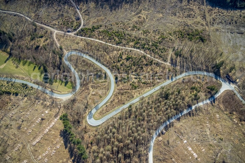 Brilon from the bird's eye view: Serpentine-shaped curve of a road guide of L870 in Brilon at Sauerland in the state North Rhine-Westphalia, Germany