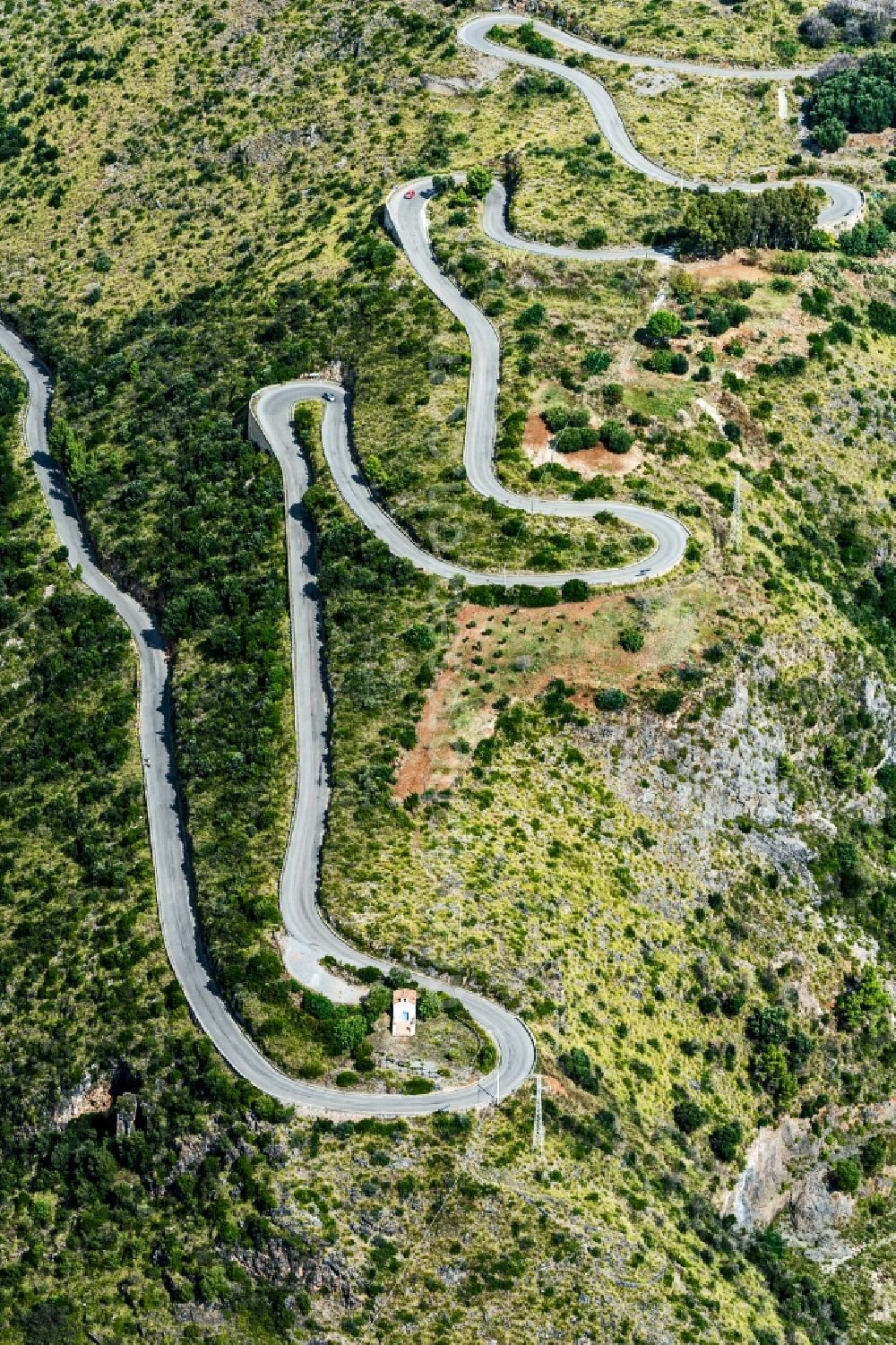 Aerial photograph Camerota - Serpentine-shaped curve of a road guide in Camerota in Italy