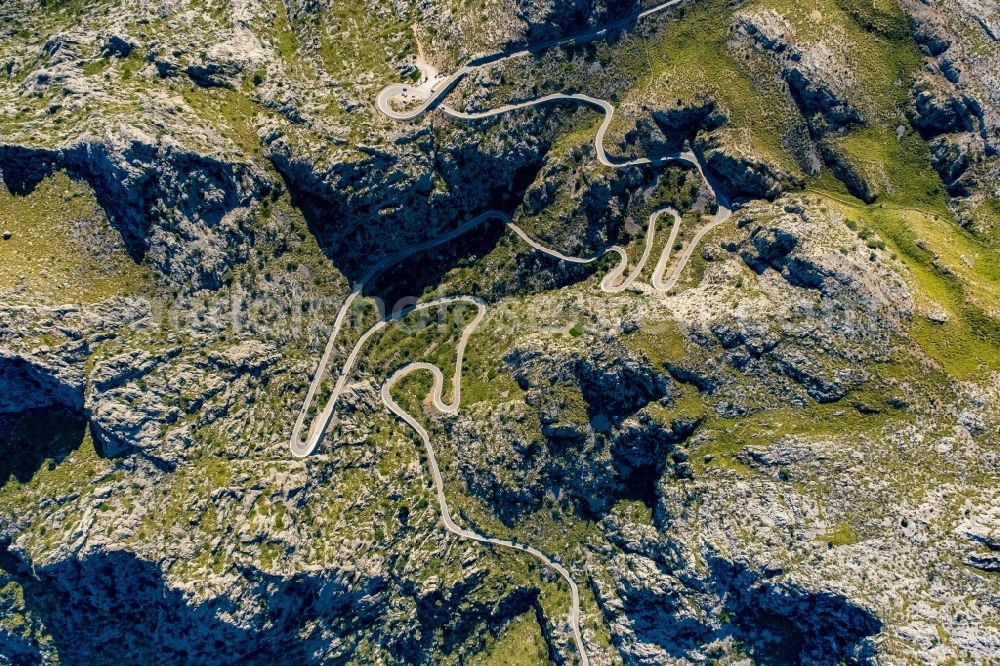 Escorca from above - Serpentine-shaped curve of a road guide in Escorca at Serra de Tramuntana in Balearic island of Mallorca, Spain