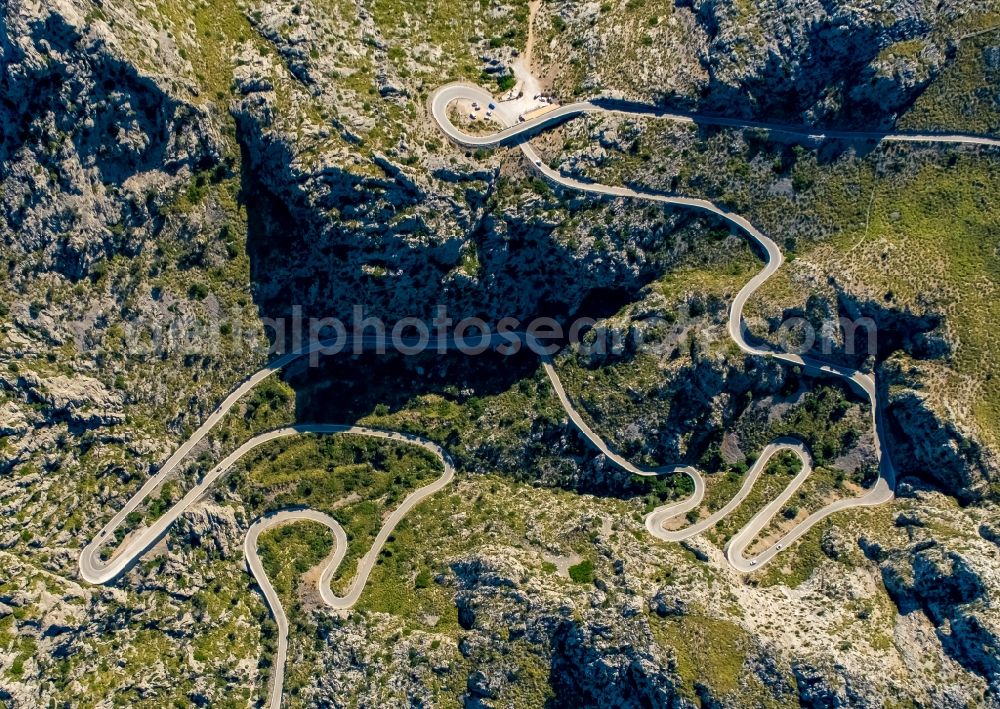 Escorca from the bird's eye view: Serpentine-shaped curve of a road guide in Escorca at Serra de Tramuntana in Balearic island of Mallorca, Spain