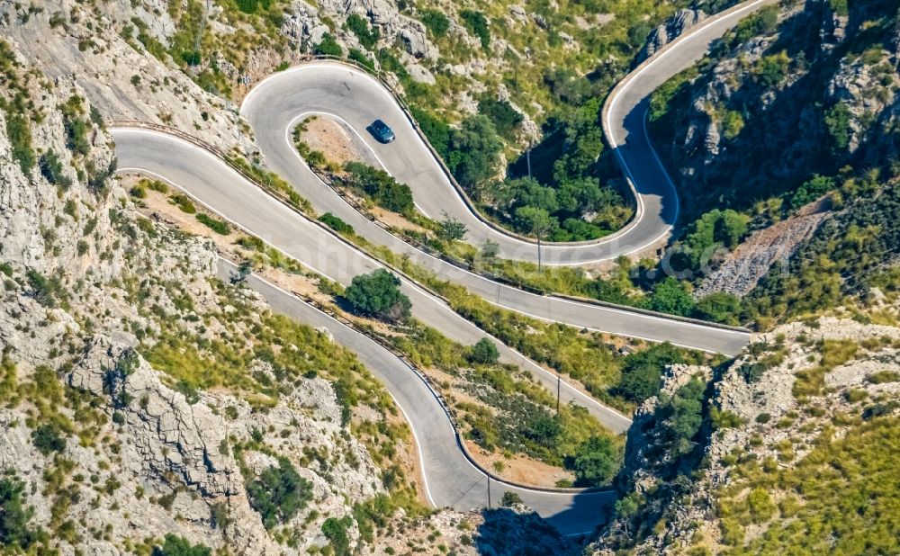 Escorca from the bird's eye view: Serpentine-shaped curve of a road guide in Escorca at Serra de Tramuntana in Balearic island of Mallorca, Spain