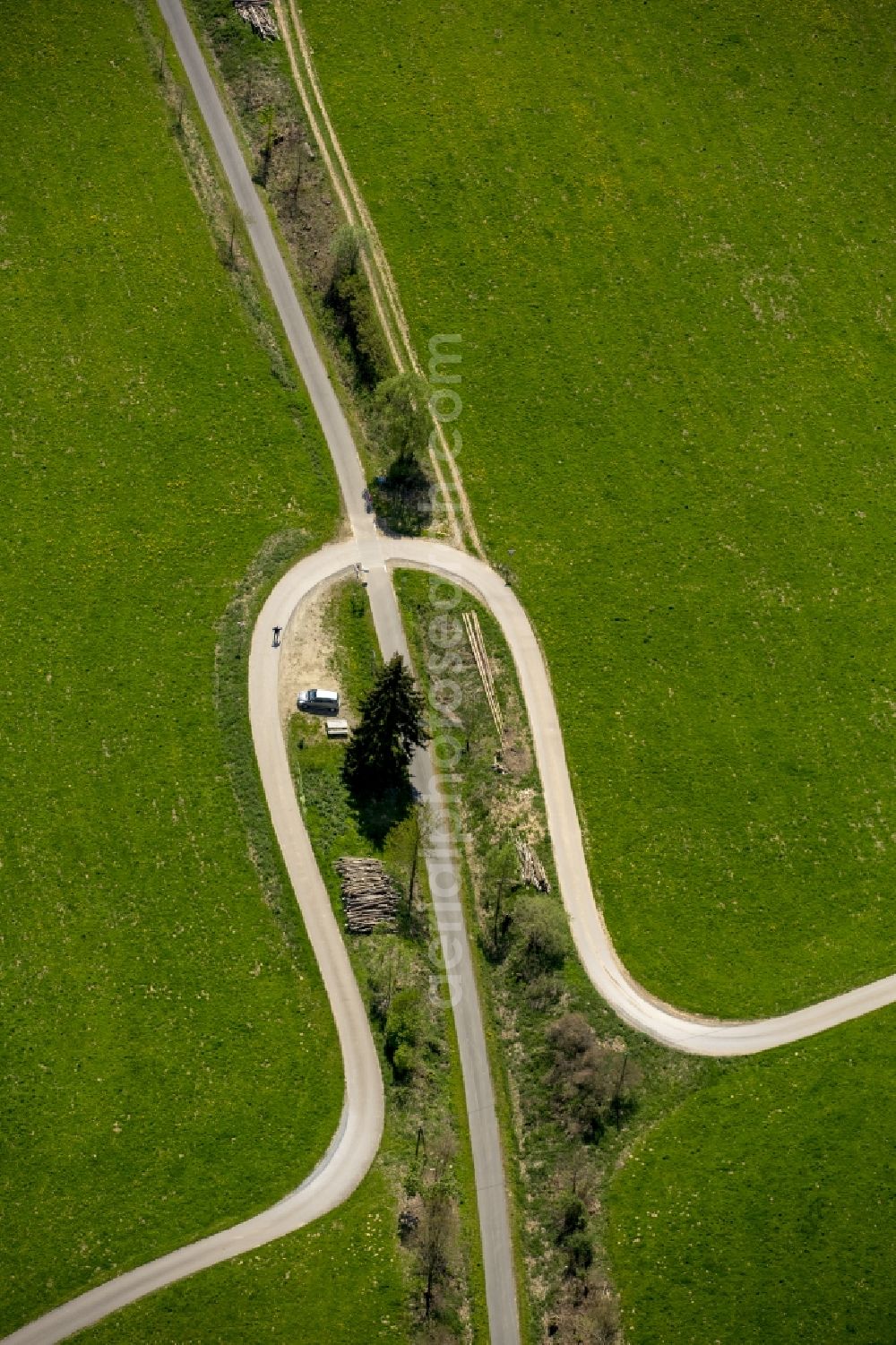 Eslohe (Sauerland) from above - Serpentine-shaped curve of a road guide in Eslohe (Sauerland) in the state North Rhine-Westphalia