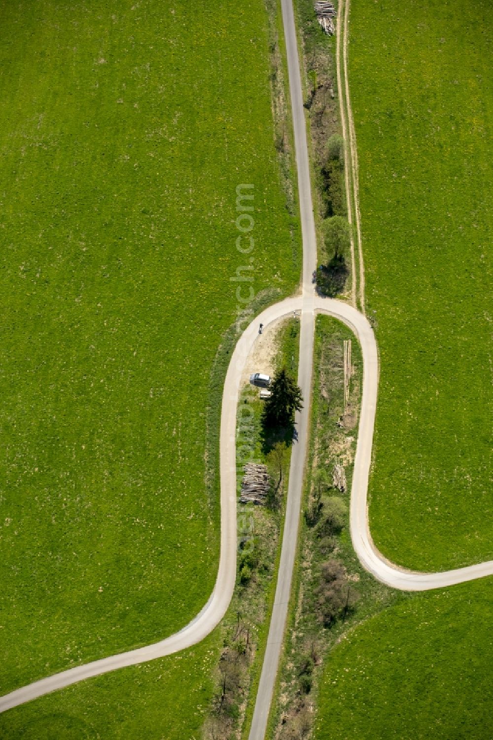 Eslohe (Sauerland) from the bird's eye view: Serpentine-shaped curve of a road guide in Eslohe (Sauerland) in the state North Rhine-Westphalia