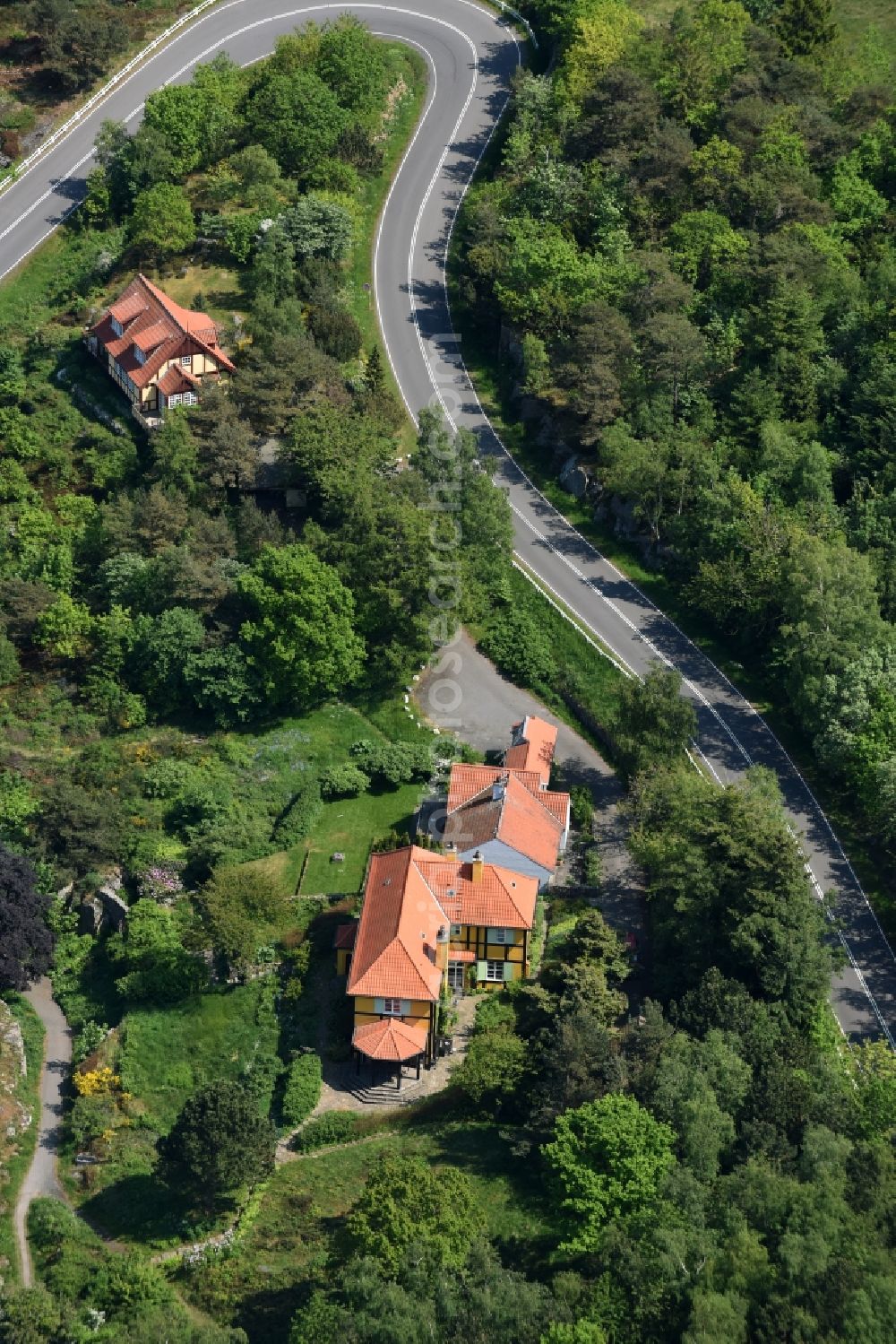 Aerial image Gudhjem - Serpentine-shaped curve of a road Norresand guide in Gudhjem in Region Hovedstaden, Denmark