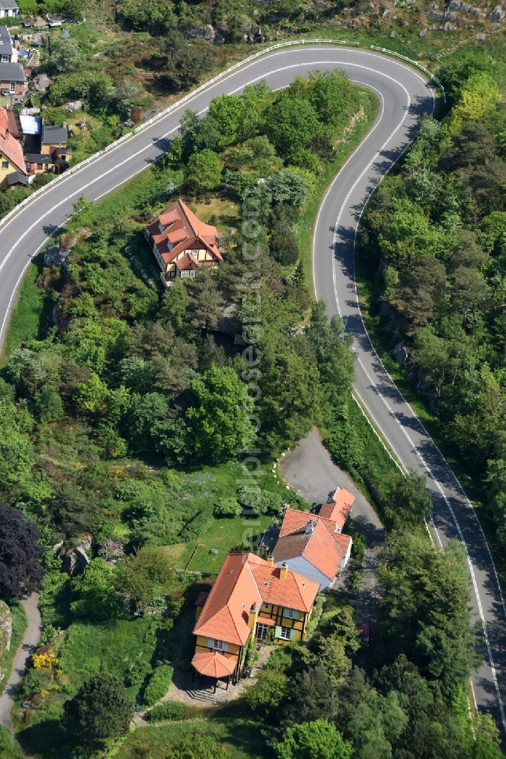 Aerial photograph Gudhjem - Serpentine-shaped curve of a road Norresand guide in Gudhjem in Region Hovedstaden, Denmark