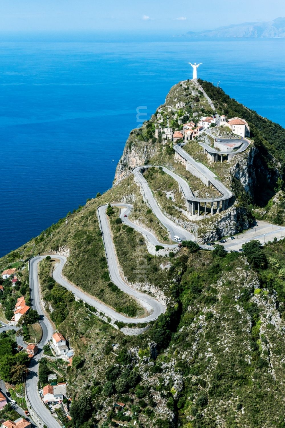 Aerial image Santa Caterina - Serpentine-shaped curve of a road guide to the statue of Christ on the Maratea Monte San Biagio in Santa Caterina in Italy