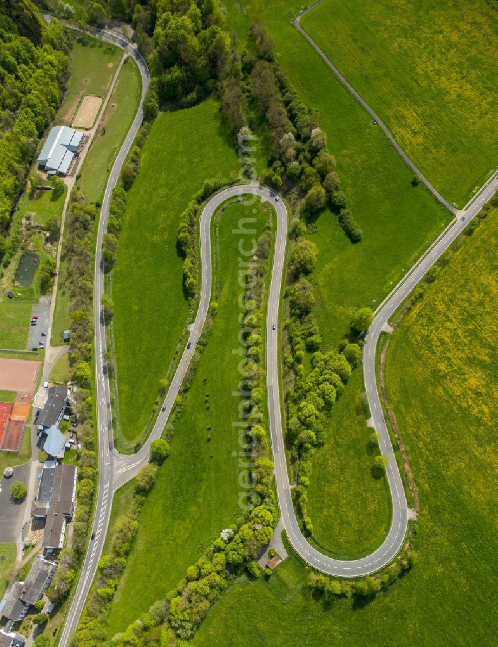 Aerial photograph Steinfeld - Serpentine-shaped curve of a road guide in Steinfeld in the state North Rhine-Westphalia