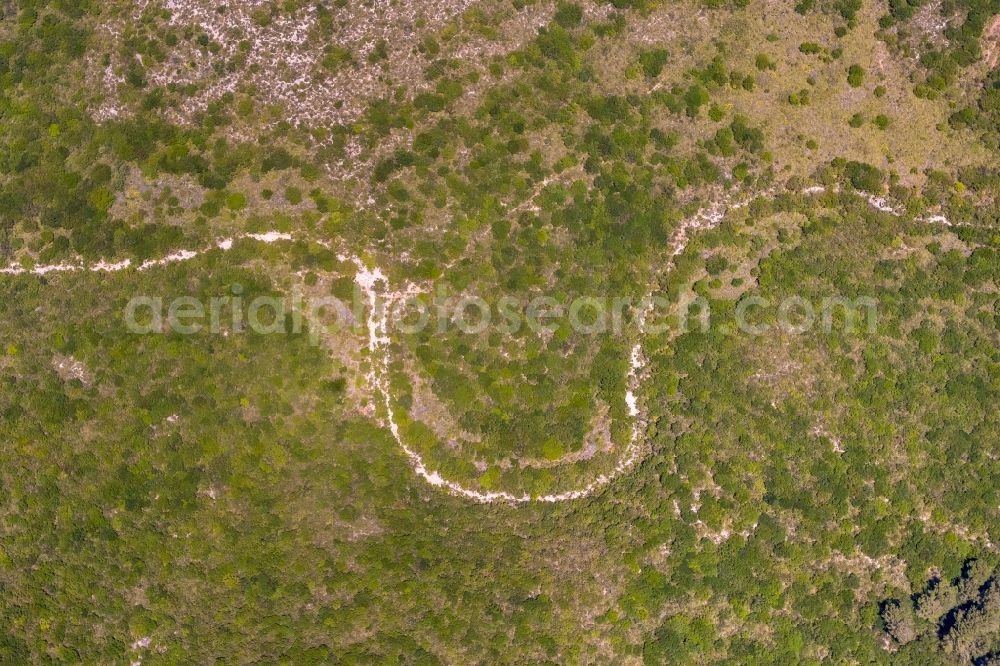 Aerial image Cala Mesquida - Serpentine-shaped curve of a road guide in Cala Mesquida in Balearic islands, Spain