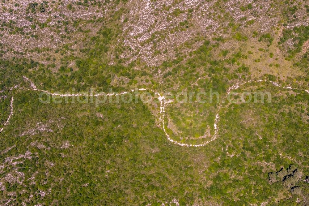 Aerial photograph Cala Mesquida - Serpentine-shaped curve of a road guide in Cala Mesquida in Balearic islands, Spain