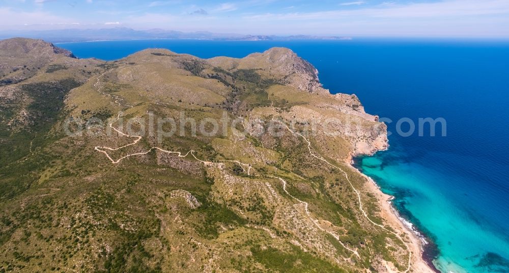 Cala Mesquida from above - Serpentine-shaped curve of a road guide in Cala Mesquida in Balearic islands, Spain