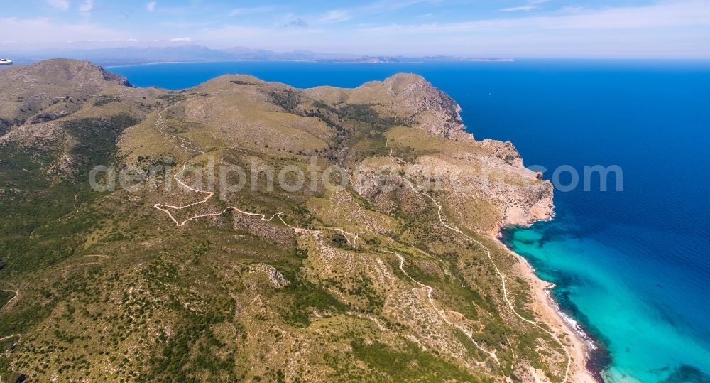 Cala Mesquida from the bird's eye view: Serpentine-shaped curve of a road guide in Cala Mesquida in Balearic islands, Spain