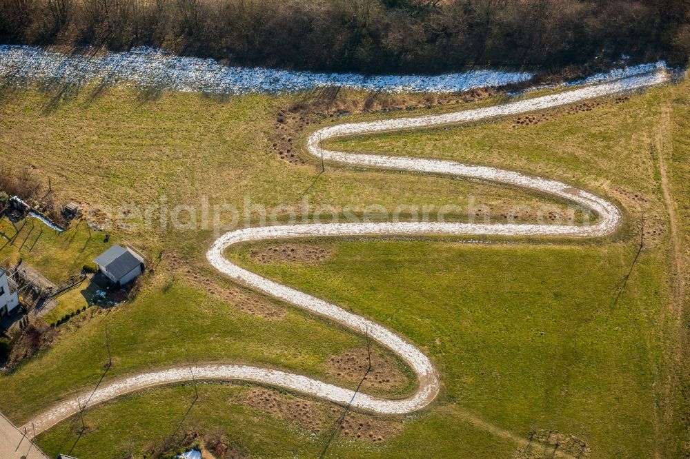 Aerial image Heiligenhaus - Serpentine-shaped curve of a road guide in Heiligenhaus in the state North Rhine-Westphalia