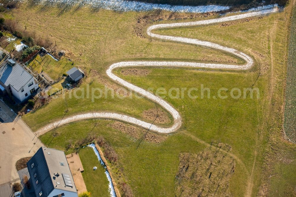 Heiligenhaus from above - Serpentine-shaped curve of a road guide in Heiligenhaus in the state North Rhine-Westphalia