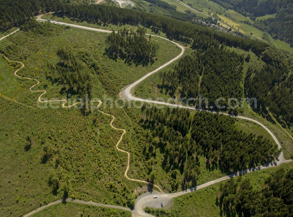 Aerial image Winterberg - Serpentine-shaped curve of a road guide in Winterberg in the state North Rhine-Westphalia