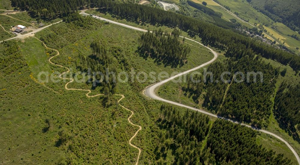 Aerial photograph Winterberg - Serpentine-shaped curve of a road guide in Winterberg in the state North Rhine-Westphalia