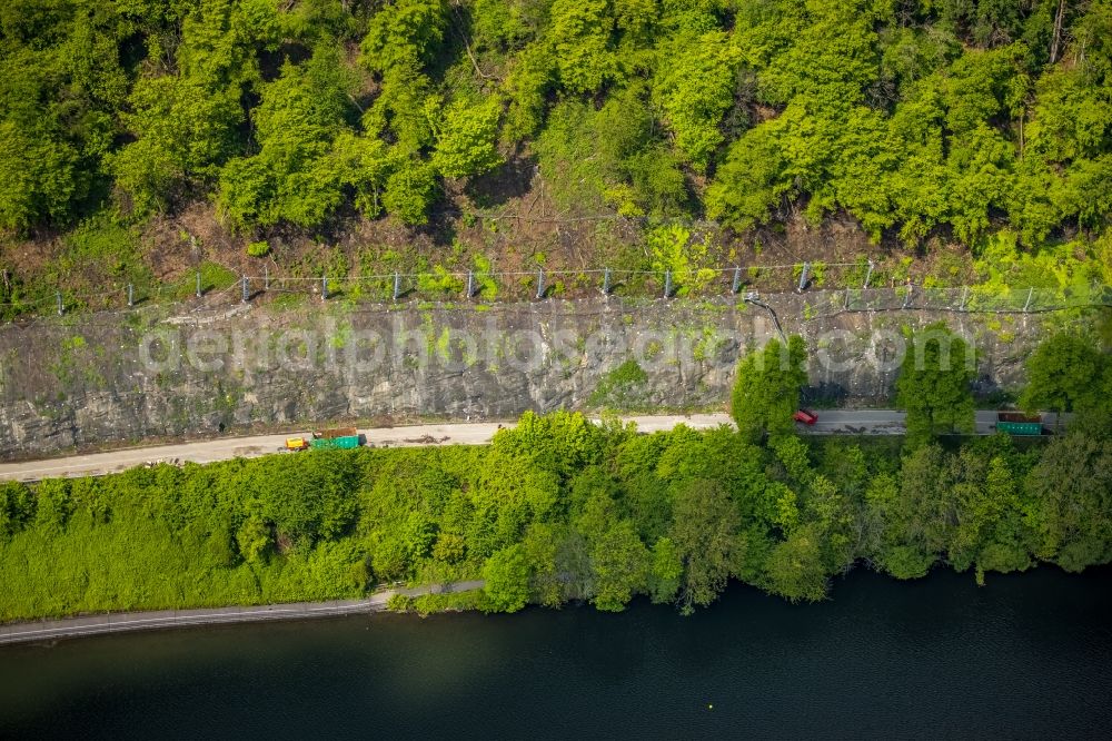 Wetter (Ruhr) from above - Securing work for the renewal of the safety fences and construction work on the closed cycle path and hiking trail on the Harkortsee on the rock massif and mountain landscape along the Kaiserstrasse - Strandweg in Wetter (Ruhr) in the state North Rhine-Westphalia, Germany