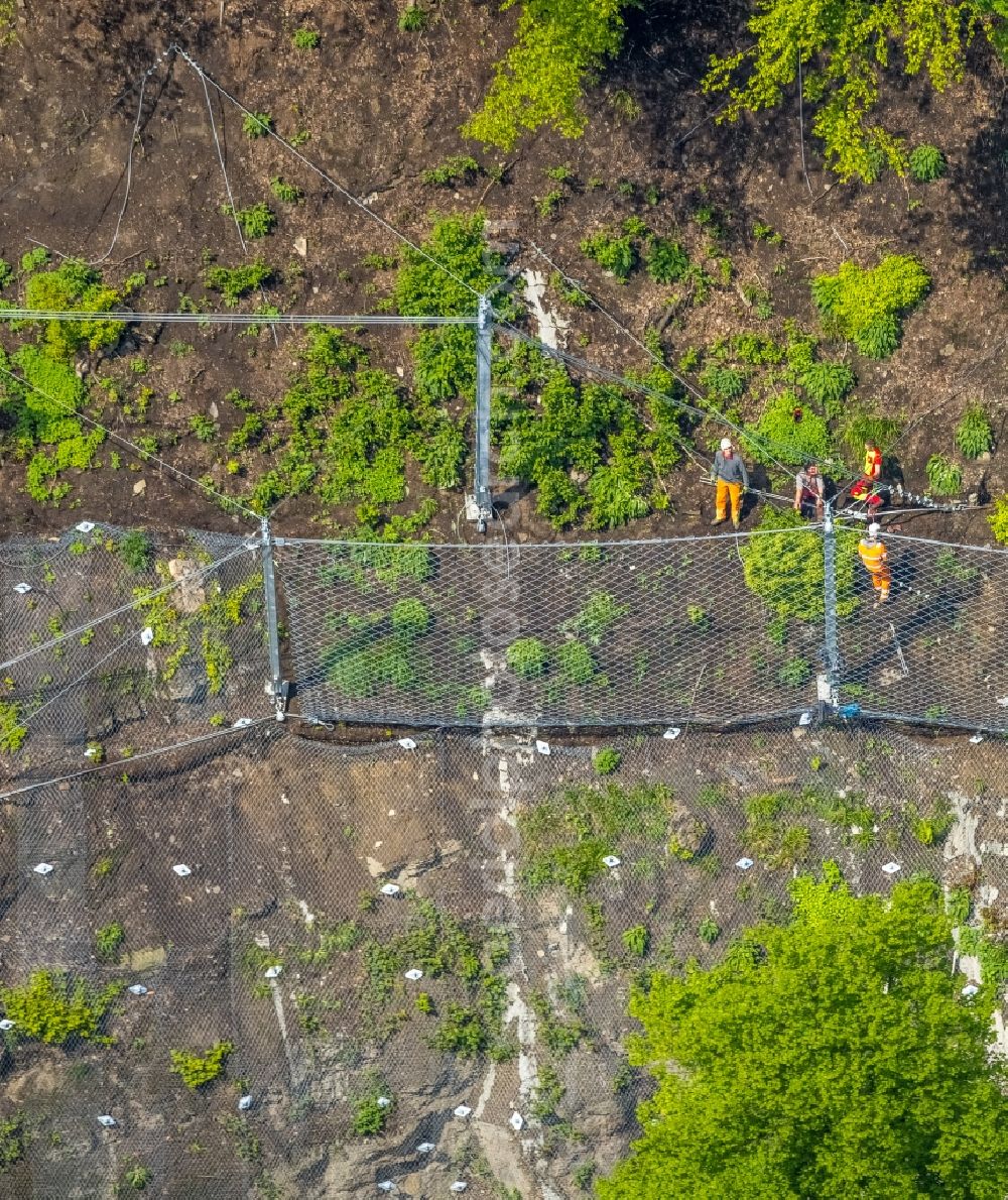 Aerial image Wetter (Ruhr) - Securing work for the renewal of the safety fences and construction work on the closed cycle path and hiking trail on the Harkortsee on the rock massif and mountain landscape along the Kaiserstrasse - Strandweg in Wetter (Ruhr) in the state North Rhine-Westphalia, Germany