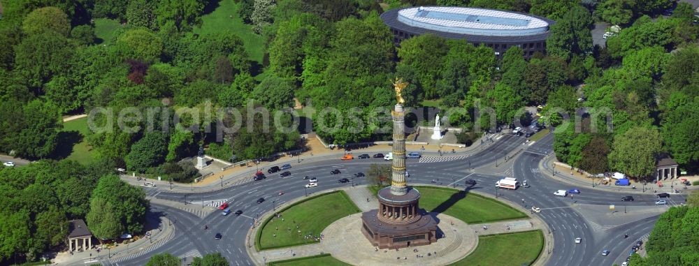 Berlin from above - The Siegessaeule at Grosser Stern in the middle of the Tiergarten in Berlin, was built from 1864 to 1873 as a national monument to the unification wars, designed by Heinrich Strack. Also on display is the Bundespraesidialamt and the street of the 17th June