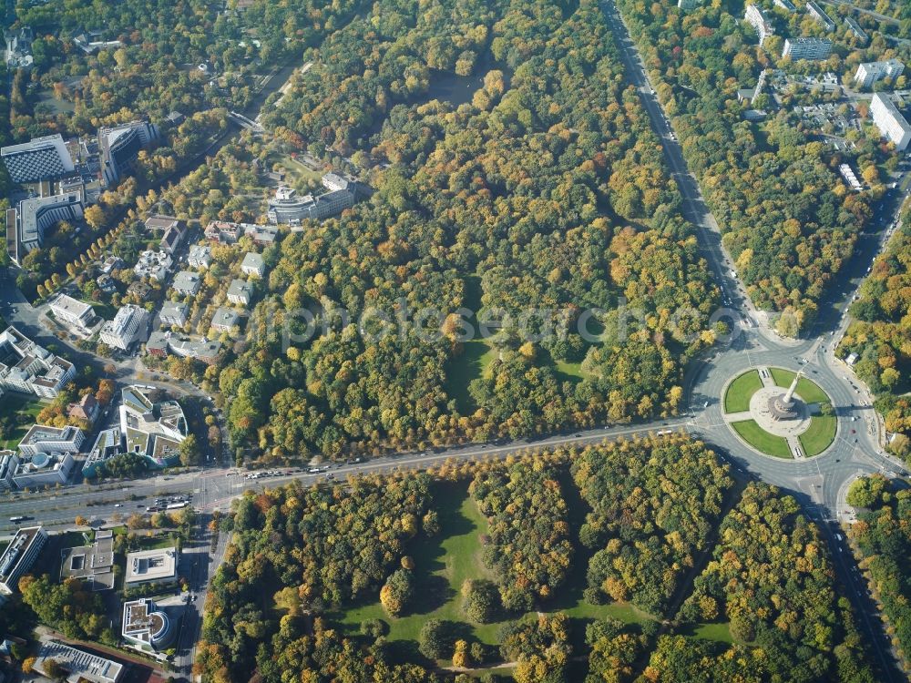 Berlin from above - The Siegessaeule at Grosser Stern in the middle of the Tiergarten in Berlin, was built from 1864 to 1873 as a national monument to the unification wars, designed by Heinrich Strack. Also on display is the Bundespraesidialamt and the street of the 17th June