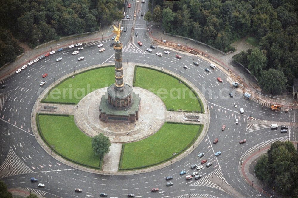 Berlin from above - The Siegessäule at Großer Stern in the middle of the Tiergarten in Berlin, was built from 1864 to 1873 as a national monument to the unification wars, designed by Heinrich Strack. Also on display is the Bundespräsidialamt and the street of the 17th June