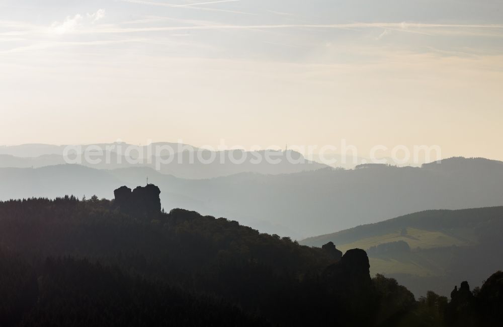 Aerial image Brilon - Silhouette backlight silhouette-like rock formation Bruchhauser stones near Brilon in the state of North Rhine-Westphalia. The known archaeological site is located in a conservation area of the Rothaargebirge