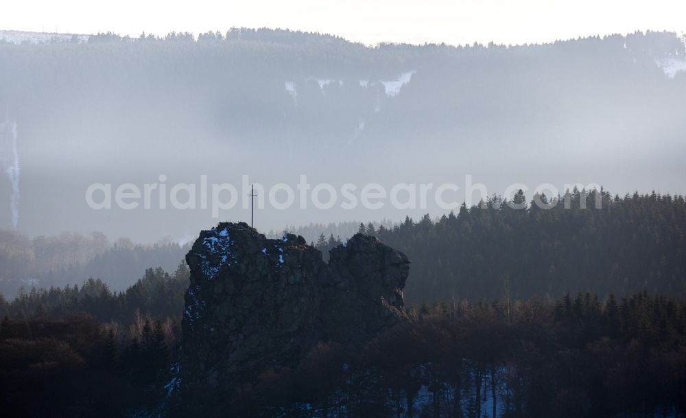 Aerial image Olsberg - Silhouette backlight silhouette-like rock formation Bruchhauser stones near Brilon in the state of North Rhine-Westphalia. The known archaeological site is located in a conservation area of the Rothaargebirge