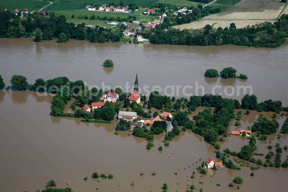 Aerial image Boritz - The situation during the flooding in East Germany on the bank of the river Elbe in the village of Boritz in the rural district of Meißen in the state of Saxony. The church and the whole village are completely enclosed by the water