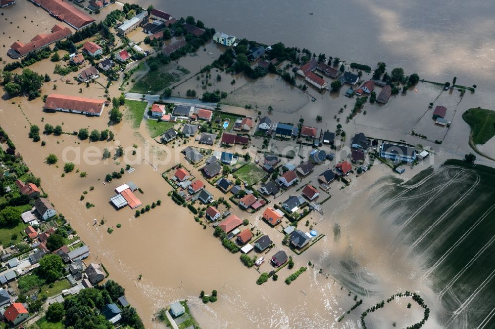 Aerial image Nünchritz - The situation during the flooding in East Germany on the bank of the river Elbe in the village of Nünchritz in the rural district of Meißen in the state of Saxony