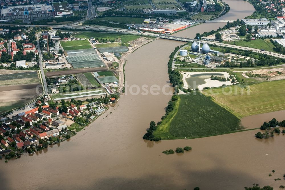 Dresden from above - The situation during the flooding in East Germany on the bank of the river Elbe in the Kaditz district of the city of Dresden in the state of Saxony. The flood channel between Kaditz and Übigau is filled with water due to the flooding. View from the North to the Elbe flood Bridge and the Autobahn A4