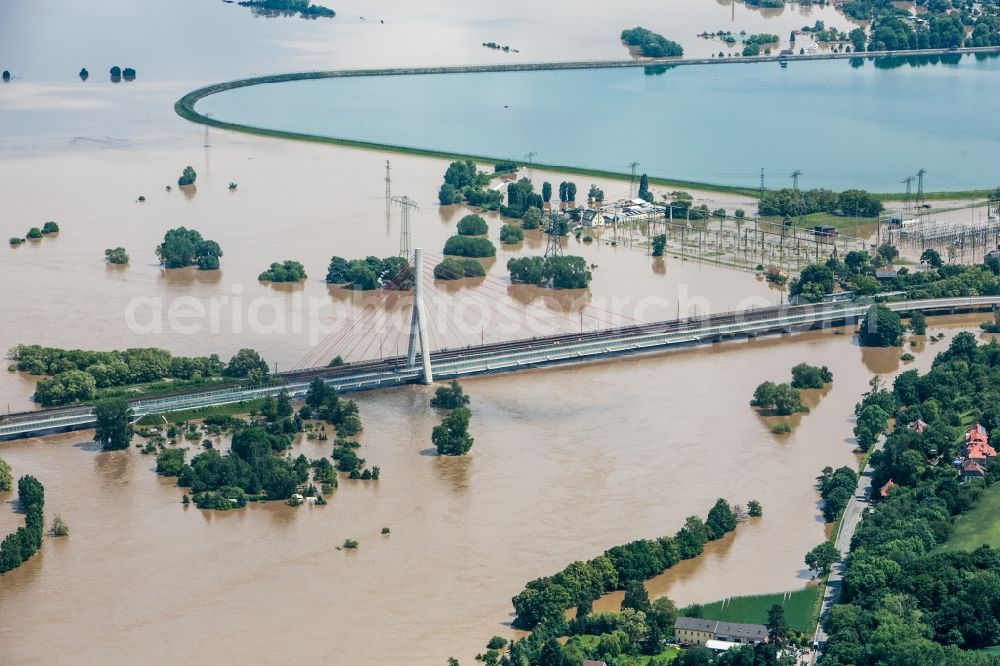 Dresden from the bird's eye view: The situation during the flooding in East Germany on the bank of the river Elbe in the Dresden district of Niederwartha at the Niederwartha pool in the free state of Saxony. View on the barrier lake which is enclosed by the flooding and high water level. The Niederwartha Bridge and S84 across the Elbe River is affected as well