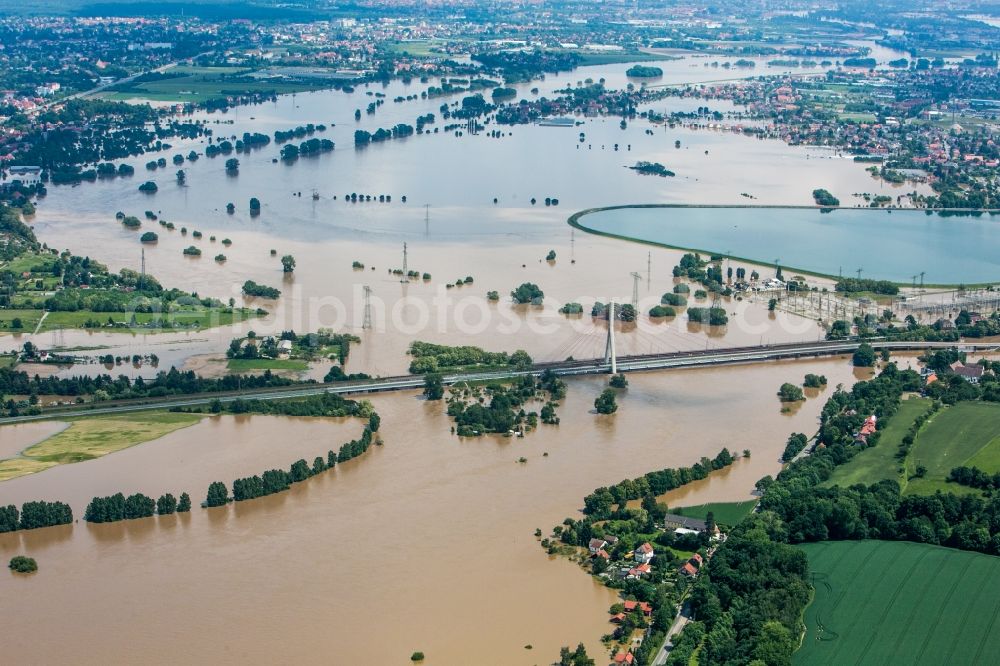 Aerial image Dresden - The situation during the flooding in East Germany on the bank of the river Elbe in the Dresden district of Niederwartha at the Niederwartha pool in the free state of Saxony. View on the barrier lake which is enclosed by the flooding and high water level. The Niederwartha Bridge and S84 across the Elbe River is affected as well