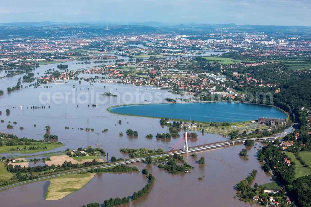 Aerial photograph Dresden - The situation during the flooding in East Germany on the bank of the river Elbe in the Dresden district of Niederwartha at the Niederwartha pool in the free state of Saxony. View on the barrier lake which is enclosed by the flooding and high water level. The Niederwartha Bridge and S84 across the Elbe River is affected as well