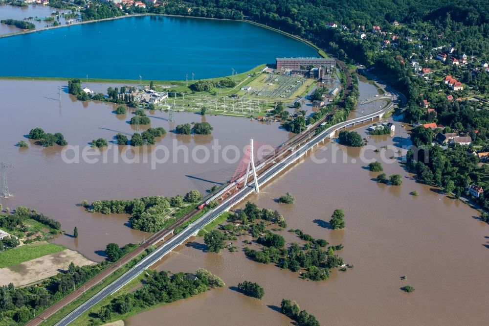 Dresden from the bird's eye view: The situation during the flooding in East Germany on the bank of the river Elbe in the Dresden district of Niederwartha at the Niederwartha pool in the free state of Saxony. View on the barrier lake which is enclosed by the flooding and high water level. The Niederwartha Bridge and S84 across the Elbe River is affected as well