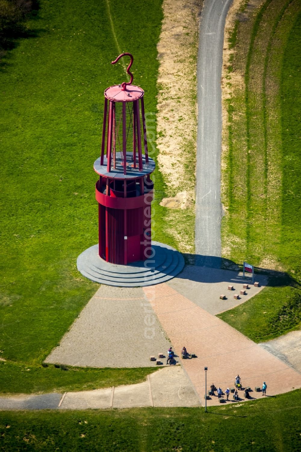 Moers from the bird's eye view: Sculpture of an oversized red miner's lamp on the grounds of renatured Halde Rheinpreussen in Moers in North Rhine-Westphalia