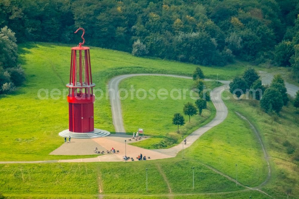 Aerial image Moers - Sculpture of an oversized red miner's lamp on the grounds of renatured Halde Rheinpreussen in Moers in North Rhine-Westphalia