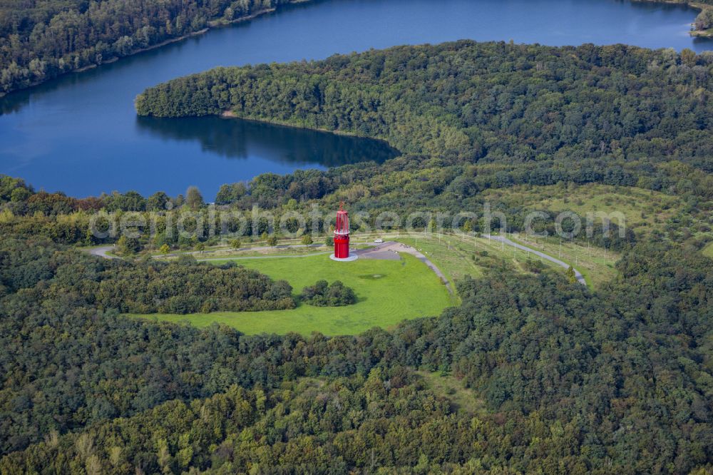 Moers from the bird's eye view: Sculpture of an oversized red mining lamp on the site of the renaturalized Rheinpreussen slag heap in Moers in the federal state of North Rhine-Westphalia