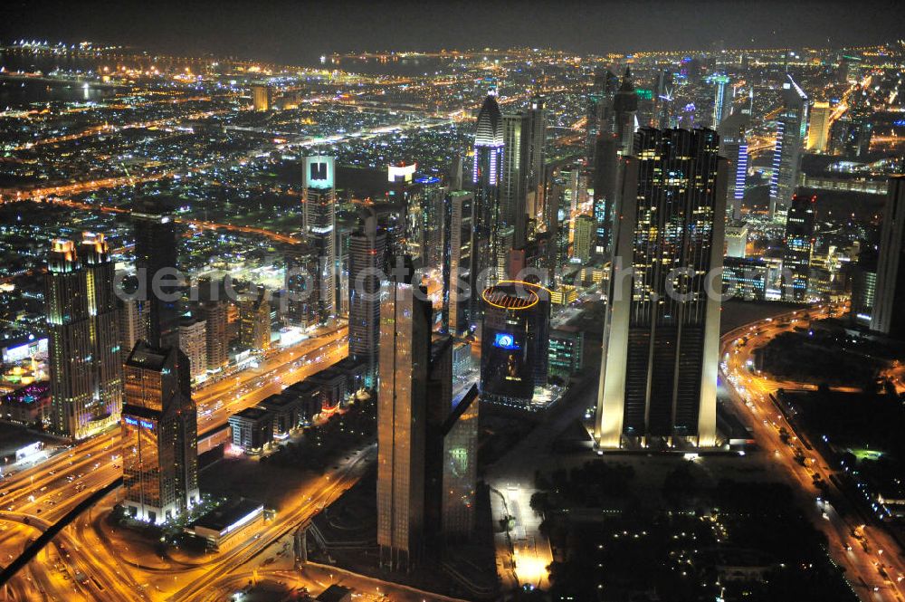 Aerial photograph DUBAI / DUBAYY - Nachtluftbild der neuen Skyline des Dubai an der Sheikh Zayed Road. Die frühere Trade Center Road ist die größte und bekannteste Straße Dubais, der Finanz- und Wirtschaftsmetropole des Mittleren Ostens. Night Aerial view of the new skyline of Dubai on Sheikh Zayed Road. The former Trade Center Road is the largest and most famous street of Dubai, the financial and economic hub of the Middle East.