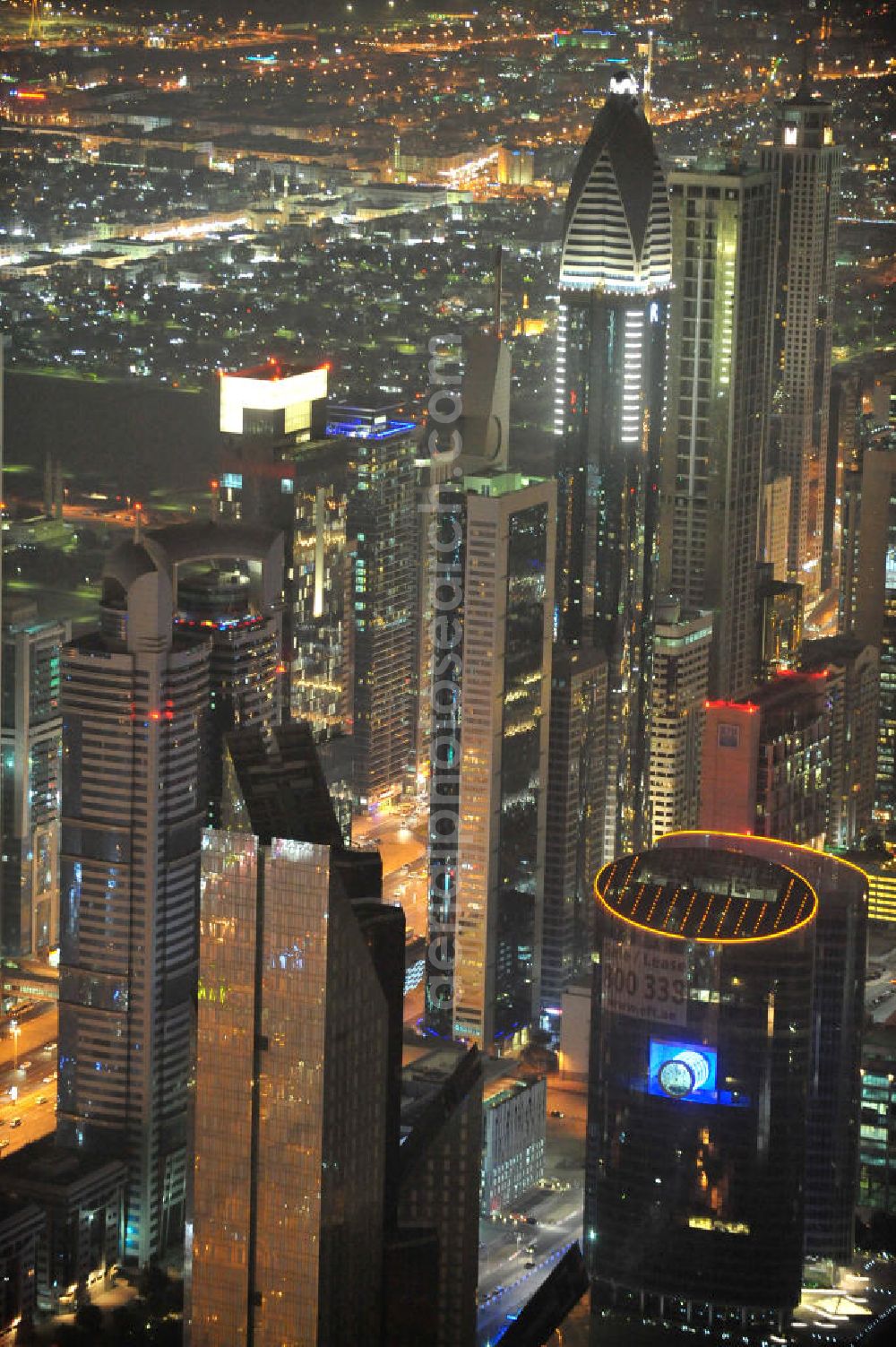 Aerial photograph DUBAI / DUBAYY - Nachtluftbild der neuen Skyline des Dubai an der Sheikh Zayed Road. Die frühere Trade Center Road ist die größte und bekannteste Straße Dubais, der Finanz- und Wirtschaftsmetropole des Mittleren Ostens. Night Aerial view of the new skyline of Dubai on Sheikh Zayed Road. The former Trade Center Road is the largest and most famous street of Dubai, the financial and economic hub of the Middle East.