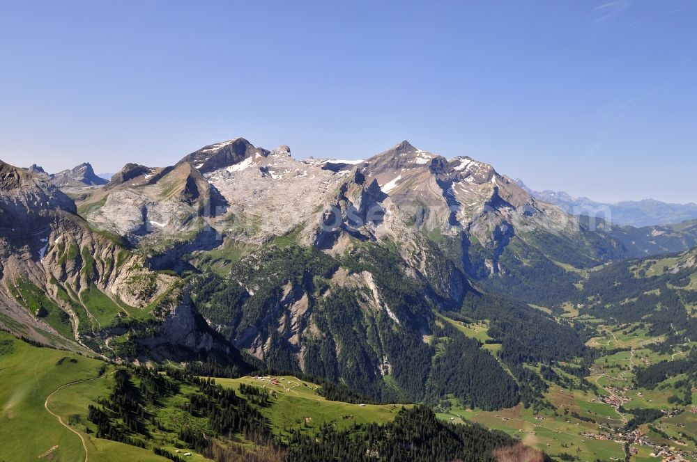 Gsteig from the bird's eye view: Skyline of the mountains Schluchhorn, Sanetschhorn (or Mont Brun) and Oldenhorn in the Bernese Alps, Switzerland. The Oldenhorn is the second highest peak of the massif of the Diablerets and canton of Vaud