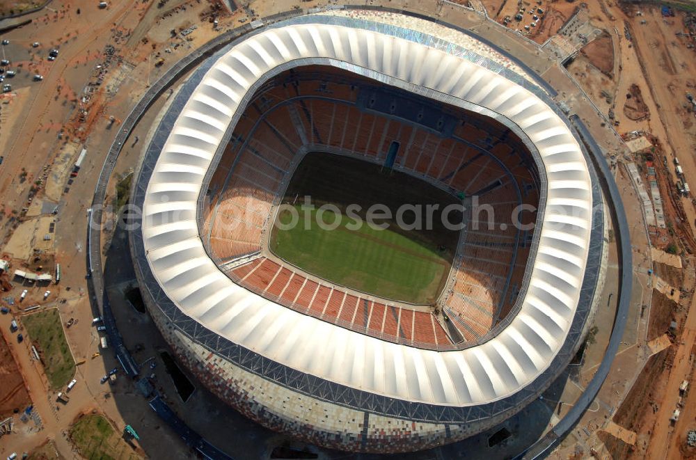 Johannesburg from the bird's eye view: Blick auf das Soccer City Stadion bzw. First-National-Bank-Stadion ( FNB-Stadion ) Johannesburg in der Provinz Gauteng von Südafrika, vor der Fußball- Weltmeisterschaft. Die Dachkonstruktion wurde vom Ingenieurbüro Schlaich, Bergermann und Partner entworfen. View of the Soccer City Stadium in Johannesburg in South Africa for the FIFA World Cup 2010.