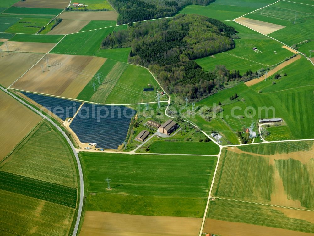 Laichingen from above - The solar plant in Laichingen in the county district of Alb-Donau-Kreis in the state of Baden-Württemberg. The collectors are surrounded by fields and acres and are placed symmetrically to collect the solar energy. The energy is then used to generate heat as well as power