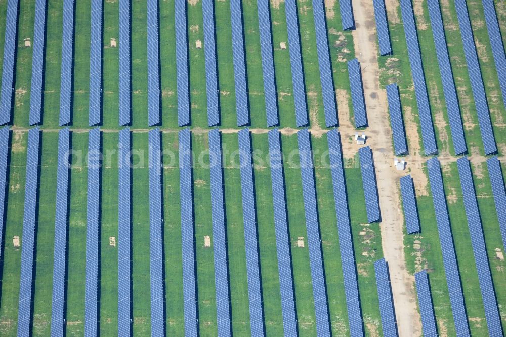 Aerial image Werneuchen - Die fast abgeschlossenen Bauarbeiten für den Solarpark / die Photovoltaikanlage Werneuchen. Die mit der Solaranlage zu bebauende Fäche befindet sich nordwestlich der Start- und Landebahn vom Sonderlandeplatz / Flugplatz Werneuchen. Ein Projekt der S Quadrat Werneuchen Grundstücks GmbH & Co. KG. Construction preparation for the Solar Park / photovoltaic system Werneuchen.