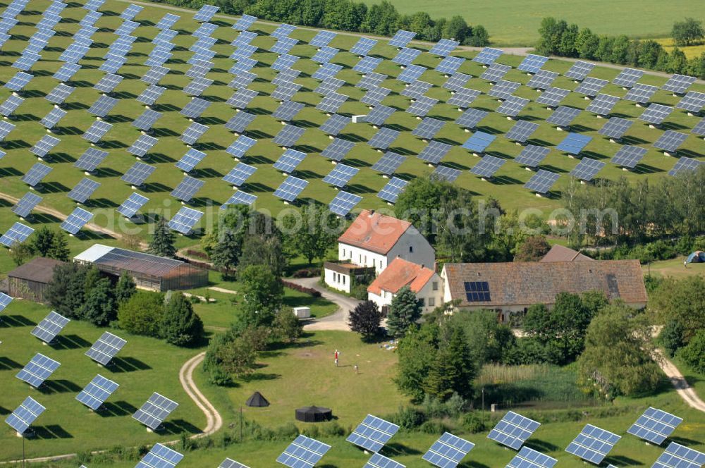 Arnstein from the bird's eye view: Blick auf das Solarfeld Erlasee (auch Solarstrompark Gut Erlasee) einem 2008 auf dem ehemaligen fränkischen Weingut Erlasee bei Arnstein im Landkreis Main-Spessart (Bayern) errichtetes Solarkraftwerk. Es ist ein Gemeinschaftsprojekt des Berliner Solarmodulherstellers Solon SE, des Projektierungs- und Vertriebsunternehmens S.A.G. Solarstrom AG und der E.ON Bayern AG. Jedes Feld ist auf einem drehbaren Untergestell montiert, was eine exakte Ausrichtung der Solarmodule zur Sonne hin ermöglicht. View of the solar field Erlasee (solar Park Good Erlasee) a 2008 on the former Frankish at Weingut Erlasee Arnstein in the district Main-Spessart (Bavaria) built solar power plant.