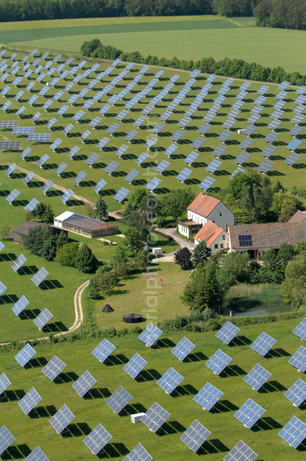 Aerial image Arnstein - Blick auf das Solarfeld Erlasee (auch Solarstrompark Gut Erlasee) einem 2008 auf dem ehemaligen fränkischen Weingut Erlasee bei Arnstein im Landkreis Main-Spessart (Bayern) errichtetes Solarkraftwerk. Es ist ein Gemeinschaftsprojekt des Berliner Solarmodulherstellers Solon SE, des Projektierungs- und Vertriebsunternehmens S.A.G. Solarstrom AG und der E.ON Bayern AG. Jedes Feld ist auf einem drehbaren Untergestell montiert, was eine exakte Ausrichtung der Solarmodule zur Sonne hin ermöglicht. View of the solar field Erlasee (solar Park Good Erlasee) a 2008 on the former Frankish at Weingut Erlasee Arnstein in the district Main-Spessart (Bavaria) built solar power plant.