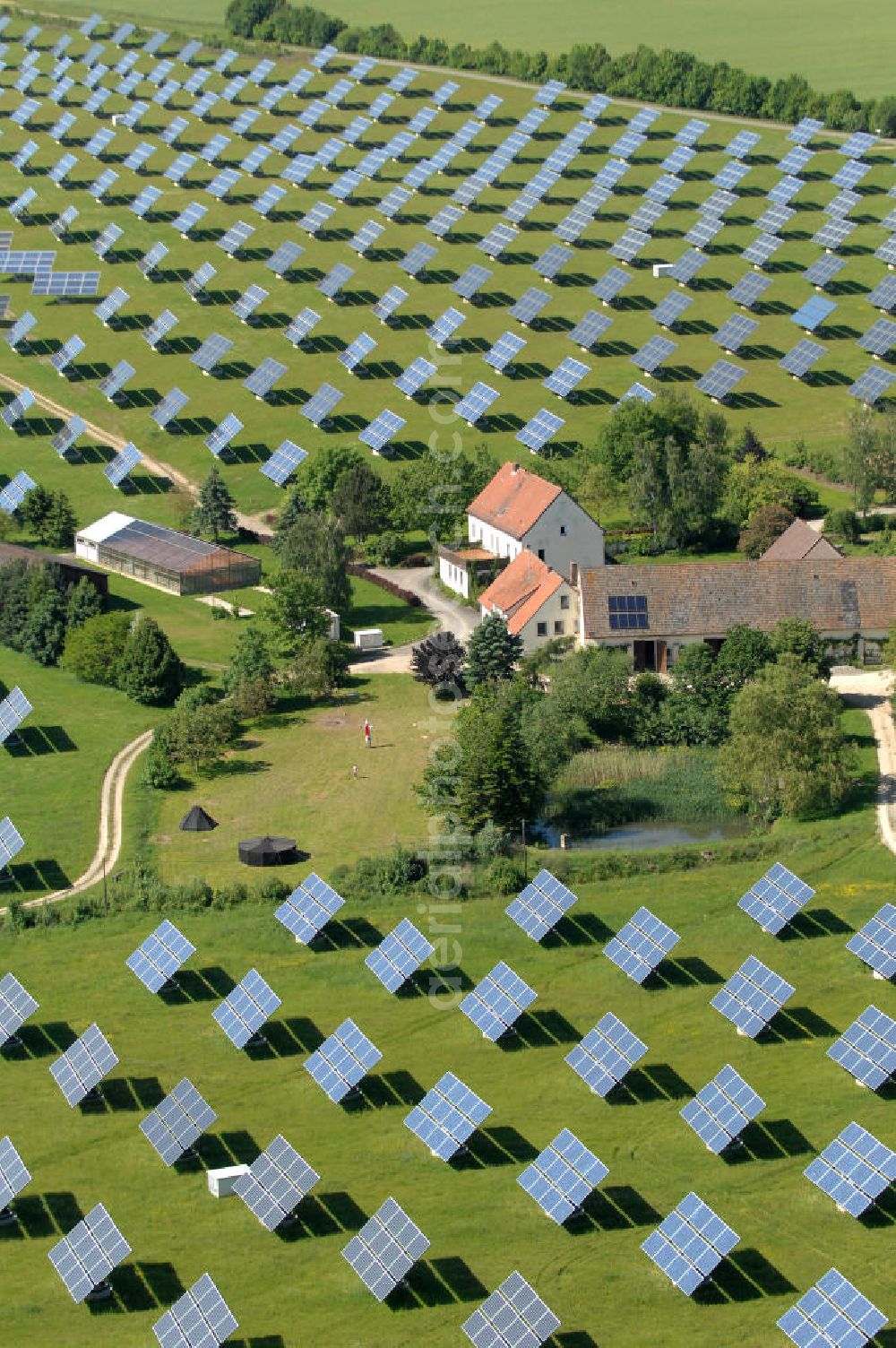 Aerial photograph Arnstein - Blick auf das Solarfeld Erlasee (auch Solarstrompark Gut Erlasee) einem 2008 auf dem ehemaligen fränkischen Weingut Erlasee bei Arnstein im Landkreis Main-Spessart (Bayern) errichtetes Solarkraftwerk. Es ist ein Gemeinschaftsprojekt des Berliner Solarmodulherstellers Solon SE, des Projektierungs- und Vertriebsunternehmens S.A.G. Solarstrom AG und der E.ON Bayern AG. Jedes Feld ist auf einem drehbaren Untergestell montiert, was eine exakte Ausrichtung der Solarmodule zur Sonne hin ermöglicht. View of the solar field Erlasee (solar Park Good Erlasee) a 2008 on the former Frankish at Weingut Erlasee Arnstein in the district Main-Spessart (Bavaria) built solar power plant.