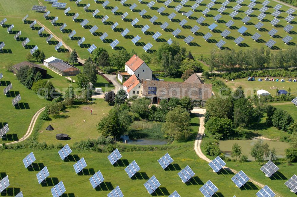 Arnstein from the bird's eye view: Blick auf das Solarfeld Erlasee (auch Solarstrompark Gut Erlasee) einem 2008 auf dem ehemaligen fränkischen Weingut Erlasee bei Arnstein im Landkreis Main-Spessart (Bayern) errichtetes Solarkraftwerk. Es ist ein Gemeinschaftsprojekt des Berliner Solarmodulherstellers Solon SE, des Projektierungs- und Vertriebsunternehmens S.A.G. Solarstrom AG und der E.ON Bayern AG. Jedes Feld ist auf einem drehbaren Untergestell montiert, was eine exakte Ausrichtung der Solarmodule zur Sonne hin ermöglicht. View of the solar field Erlasee (solar Park Good Erlasee) a 2008 on the former Frankish at Weingut Erlasee Arnstein in the district Main-Spessart (Bavaria) built solar power plant.