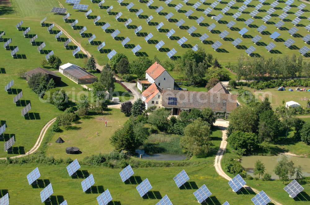 Aerial image Arnstein - Blick auf das Solarfeld Erlasee (auch Solarstrompark Gut Erlasee) einem 2008 auf dem ehemaligen fränkischen Weingut Erlasee bei Arnstein im Landkreis Main-Spessart (Bayern) errichtetes Solarkraftwerk. Es ist ein Gemeinschaftsprojekt des Berliner Solarmodulherstellers Solon SE, des Projektierungs- und Vertriebsunternehmens S.A.G. Solarstrom AG und der E.ON Bayern AG. Jedes Feld ist auf einem drehbaren Untergestell montiert, was eine exakte Ausrichtung der Solarmodule zur Sonne hin ermöglicht. View of the solar field Erlasee (solar Park Good Erlasee) a 2008 on the former Frankish at Weingut Erlasee Arnstein in the district Main-Spessart (Bavaria) built solar power plant.